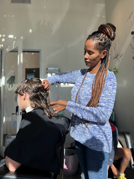 Tamekia Dolan, founder of Unity Salon and Salongevity, cutting hair in her Norterra Phoenix salon